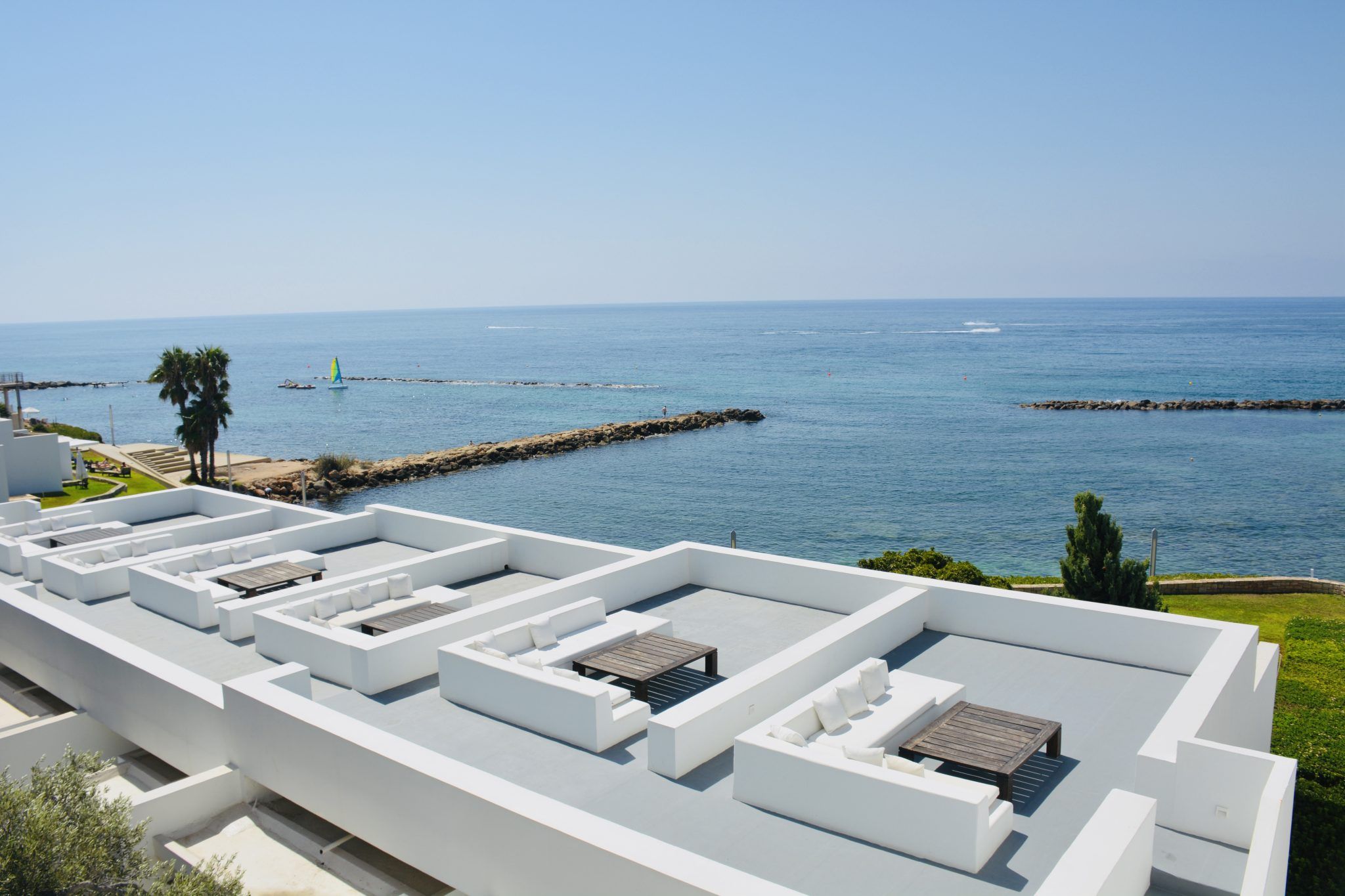 White terraces of a Mediterranean building overlooking the sea
